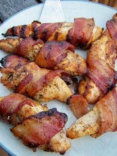I loved this recipe because most of the chicken I make has some kind of marinade. Sweet and spicy bacon chicken on a white plate.