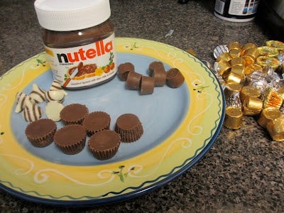 This cookie recipe is probably one of the best that I have tried because the cookie part is so soft! It stays soft for a couple days after you make them! Herseys Kisses, small Reeses cups, Rolos and Nutella on a festive plate.