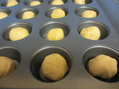 This cookie recipe is probably one of the best that I have tried because the cookie part is so soft! It stays soft for a couple days after you make them! Balls of dough in a muffin tin.