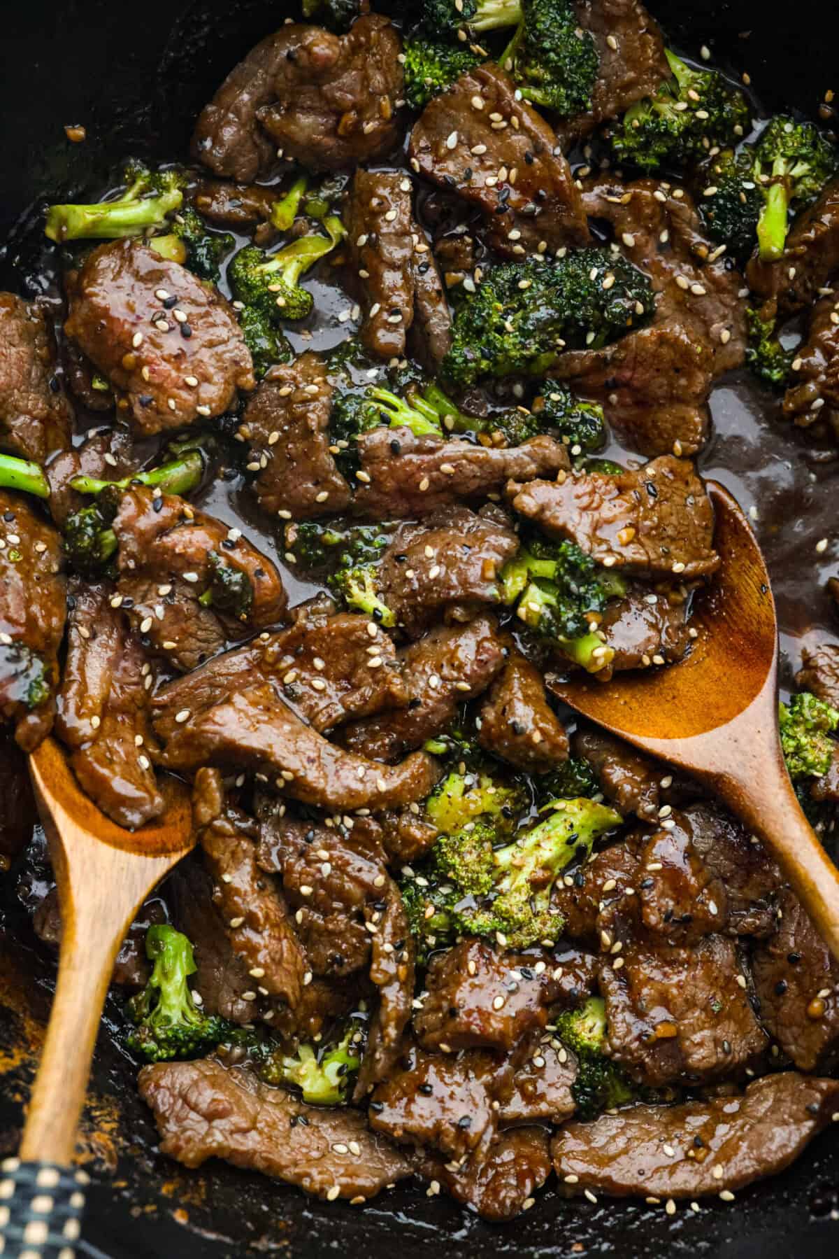 This Mongolian beef and broccoli recipe is the best P.F. Chang’s copycat recipe. You will love the combination of tender beef, vibrant broccoli and intensely flavorful sauce. Save yourself money while making your family happy with this quick and easy recipe. Close up shot of Mongolian beef and broccoli.