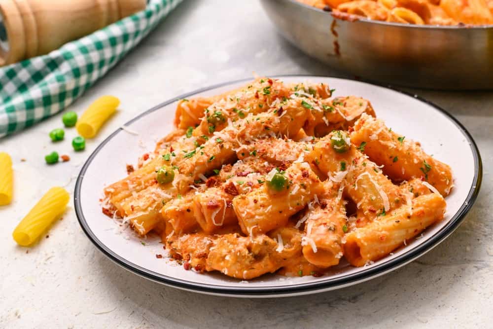 This spicy chicken rigatoni is one of our family favorites and easy to make recipes that Spicy chicken rigatoni on a white plate.