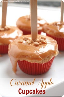 I had so much fun making these and they tasted just like I was biting into a caramel apple! Caramel Apple Cupcakes with a red wrapper.