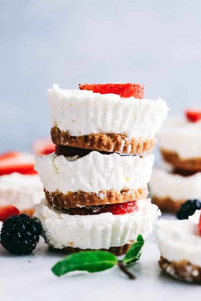 Cheesecake without the guilt! These skinny mini cheesecakes are light, creamy and will melt in your mouth with every bite! This low-calorie dessert is just what you need to satisfy your sweet tooth and stick to your New Year's resolution. A stack of 3 cheesecake bites.