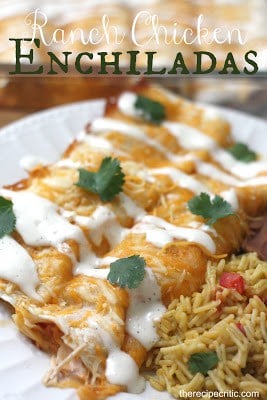 Since our family is {obsessed} with ranch I made this delicious recipe creation. My hubby says it is one of the best things we have had yet! Ranch Chicken Enchiladas on a white plate with green garnish and a side of rice.