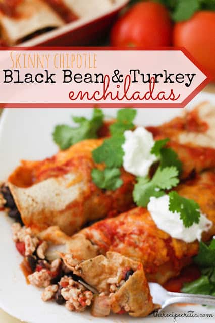 I love this mexican delicious dinner! Packed with flavor and texture, it is a new favorite! 2 black bean and turkey enchiladas lay on a white plate garnished with cilantro and sour cream.