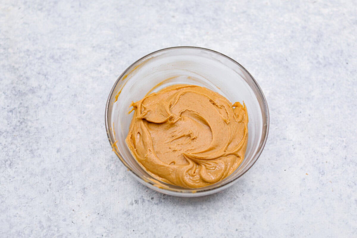 The best of both worlds collide in these peanut butter brownies! Fudgy homemade brownies are swirled with a sweet peanut butter mixture. The combination is an explosion of rich decadent flavors! Sixth photo of the peanut butter mixture mixed together.