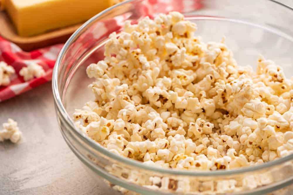 Amazing Salted Caramel Popcorn is a sweet and salty snack with melted caramel covering each popcorn for a soft, crunchy, rich and chewy snack! The Ultimate Sweet and Savory Snack! popped popcorn