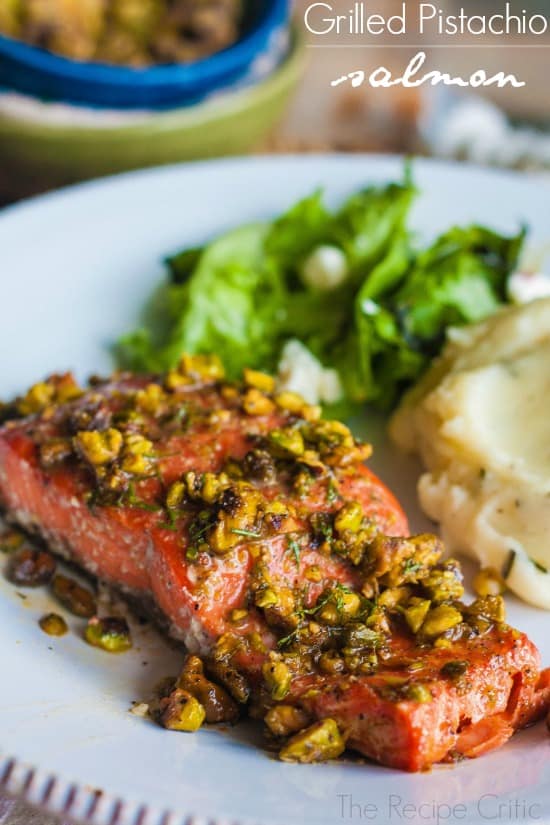 A delicious and light lemon pepper salmon that is ready in a matter of minutes! Grilled Pistachio Salmon on a white plate.
