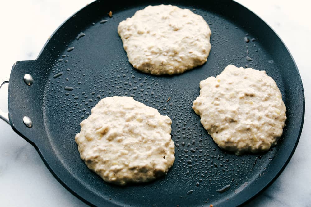 These banana pancakes are perfectly soft and fluffy and taste just like warm banana bread... in pancake form, of course! It's a great recipe to use when you have any over-ripe bananas! banana pancakes on the skillet