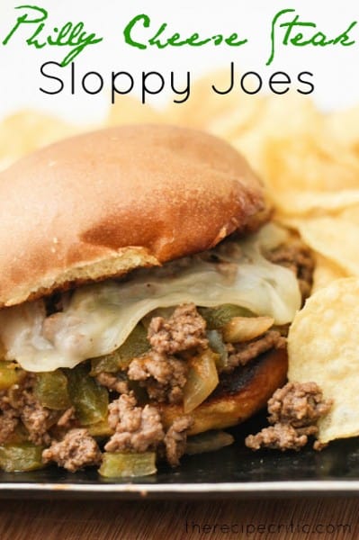 A delicious greek spin on sloppy joes that are full of flavor and a meal that everyone will love! Philly Cheese Steak Sloppy Joe on a black plate with chips.