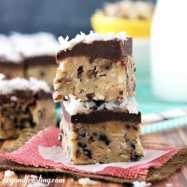 Amazing NO BAKE almond joy cookie dough bars that are packed with delicious flavors! Almond Joy Cookie Dough Bars stack on top of one another.