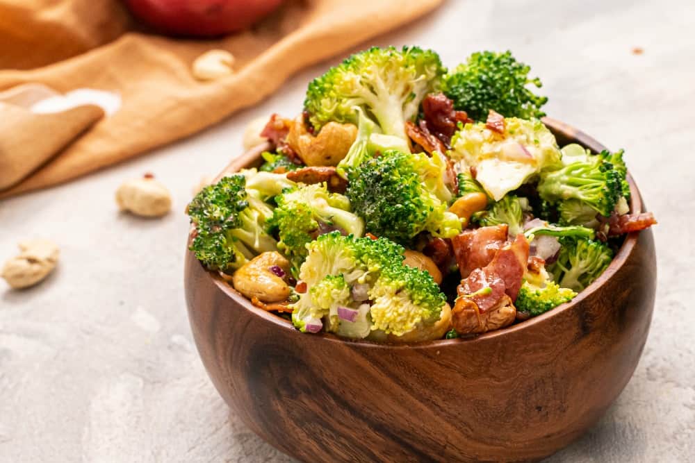 Broccoli Cashew Salad is a perfect cool and crunchy salad filled with savory bacon crumbles, cashews and broccoli, all covered in an amazing dressing. You will be making this all the time once you see how easy and delicious it is! Broccoli Salad in a bowl