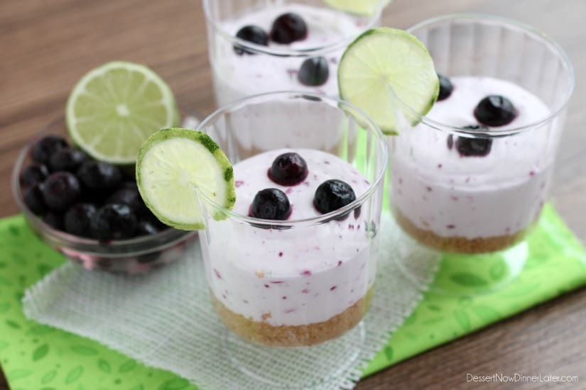 A delicious No Bake Blueberry Lime Cheesecake dessert that the family is sure to love! Blueberry Lime No-Bake Cheesecake Cups with fresh lime and blueberries on the side.