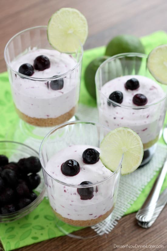 A delicious No Bake Blueberry Lime Cheesecake dessert that the family is sure to love! Blueberry Lime No-Bake Cheesecake Cups with fresh lemon and blueberries on the side.