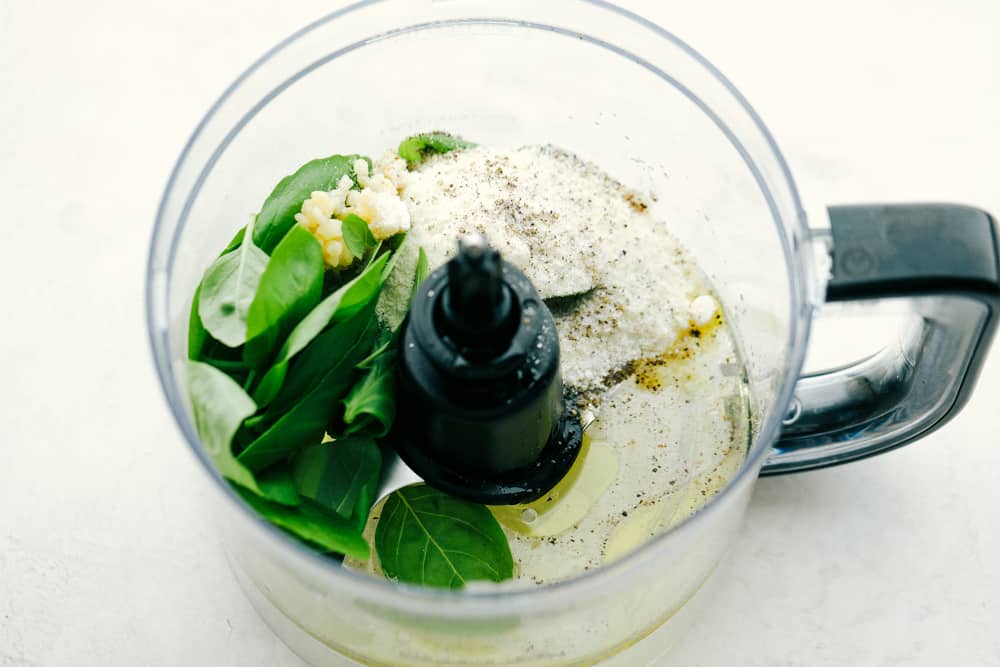 A delicious and flavorful pasta salad that is so easy to throw together! Ingredients of Caprese Pasta Salad in mixer.
