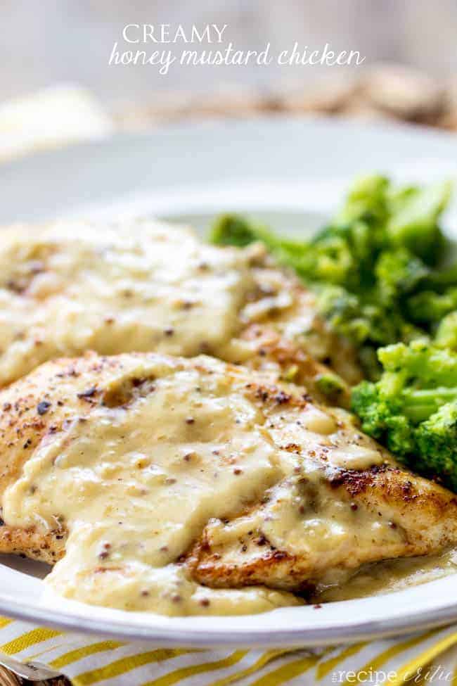A delicious 30 minute meal that has a tangy, creamy and bold honey mustard sauce on top! Creamy honey mustard chicken served on a plate with broccoli as a side dish.