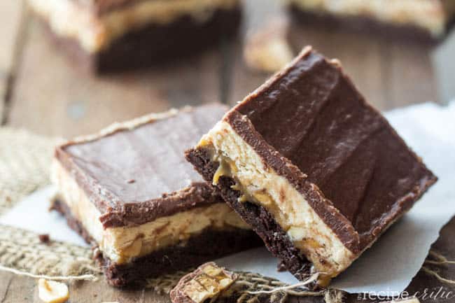 An amazing fudgy brownie that is layered with caramel, peanuts, and nougat and tastes exactly like a Snickers!! Snickers brownies stacked on top of each other.