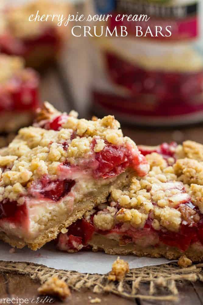 Delicious Cherry Pie Bars swirled with a creamy sour cream center and taste like a cherry pie in each and every bite! Cherry pie sour cream crumb bars on top of each other.