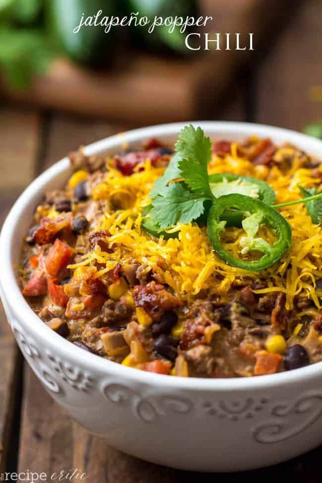 Everything that I loved about this jalapeño popper dip was represented in this delicious chili. I am not even lying when I say that this made the list of Jalapeno popper chili in a white bowl garnished with jalapeños and cilantro.