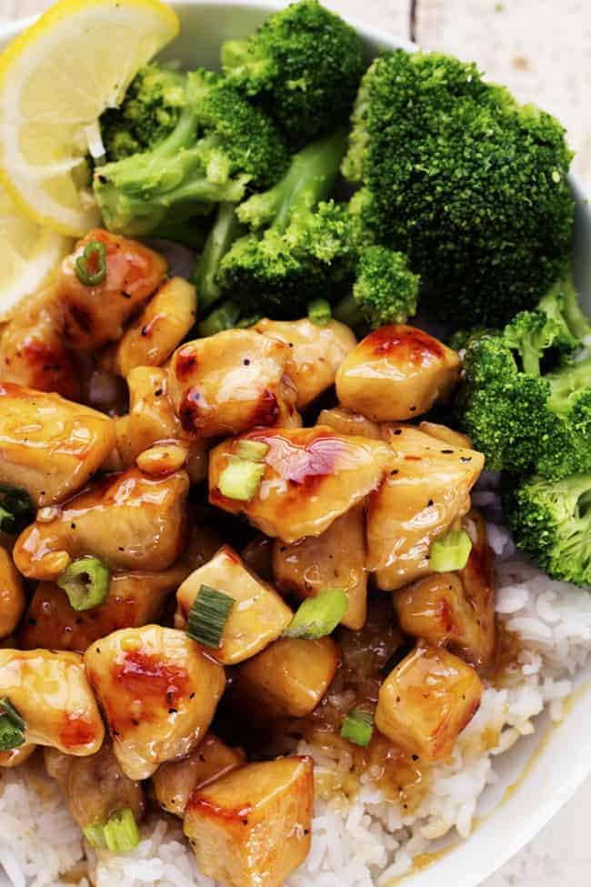 A light and delicious meal that is full of amazing honey lemon ginger flavor that the family will love! Honey lemon ginger chicken plated with rice and broccoli.