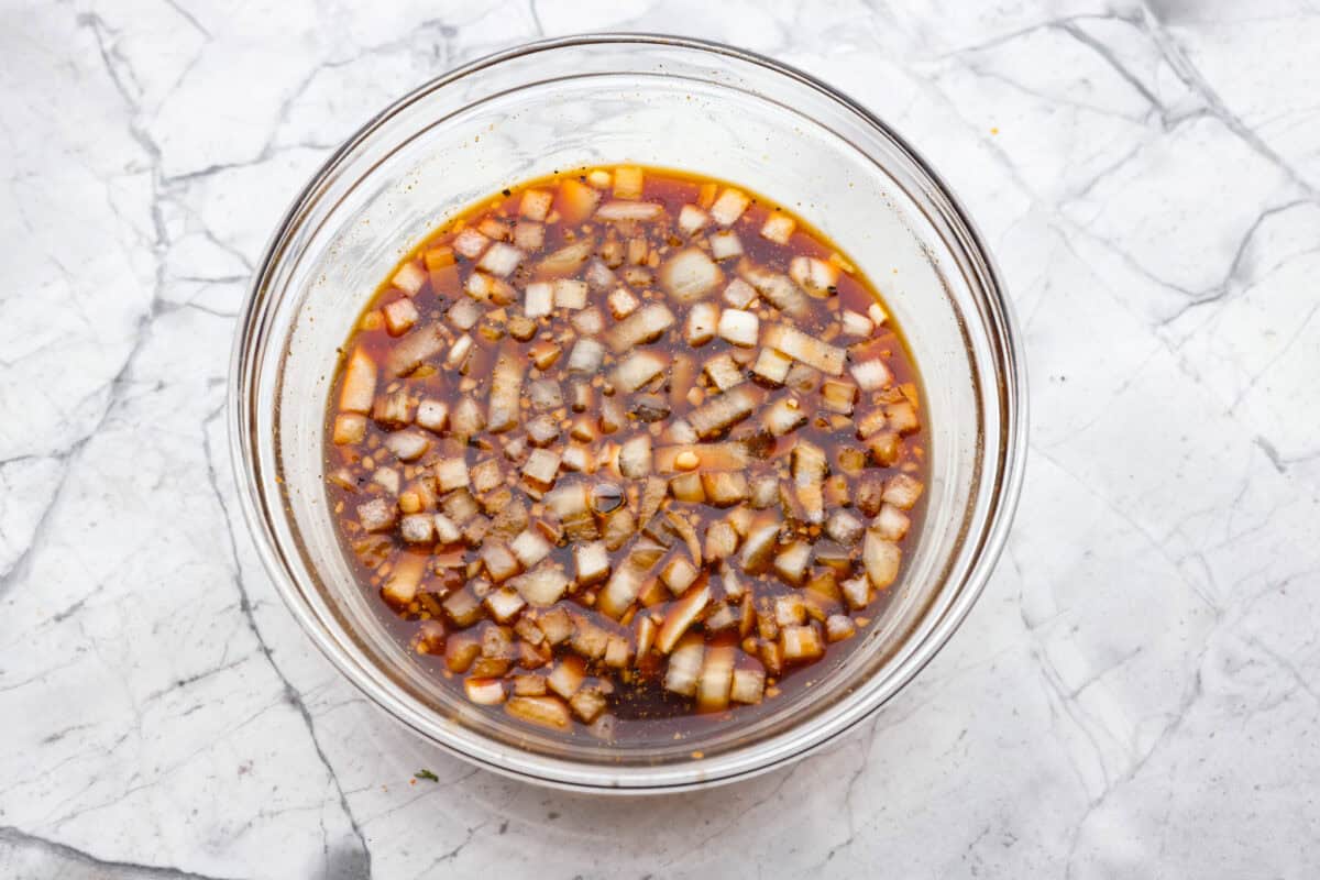 This slow cooker honey teriyaki chicken is so easy to throw together, and the flavor is out of this world! The chicken cooks to perfection and will be one of the best things you'll ever make! Overhead shot of sauce ingredients mixed together in a bowl.