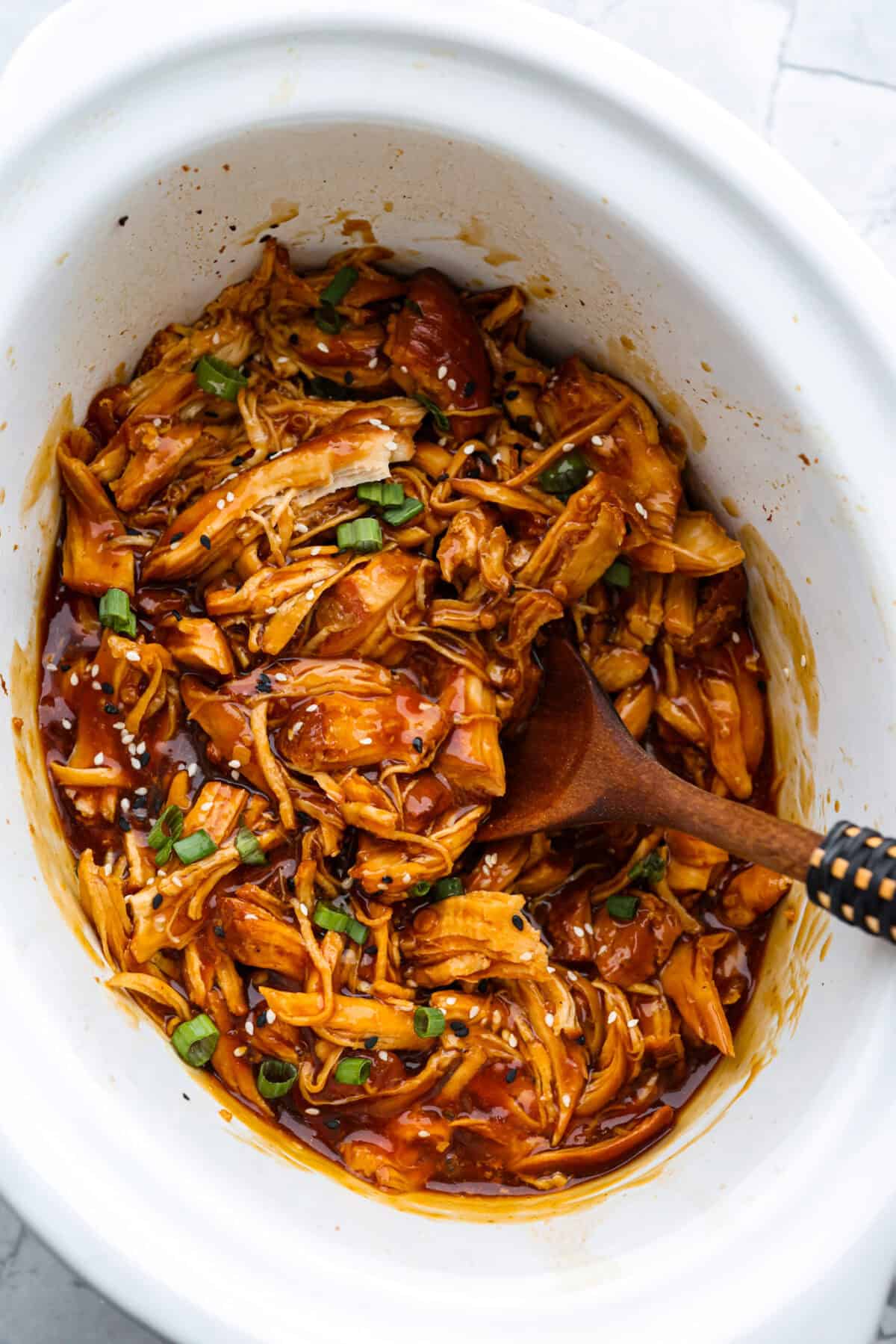 This slow cooker honey teriyaki chicken is so easy to throw together, and the flavor is out of this world! The chicken cooks to perfection and will be one of the best things you'll ever make! Overhead shot of slow cooker honey teriyaki chicken