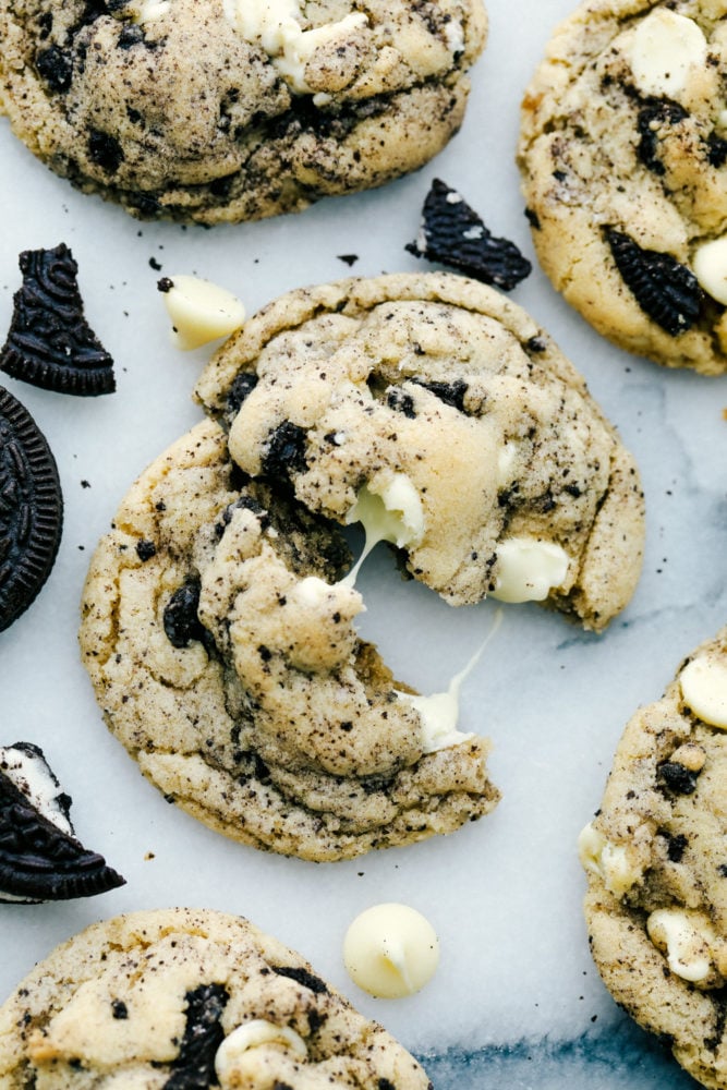 White Chocolate Oreo Cookies are perfectly soft and chewy cookies loaded with slightly melted white chocolate chips and crushed Oreo cookies. These are warm and delicious cookies with just the right amount of sweetness!ย White chocolate oreo cookies split apart to see the melted white chocolate.