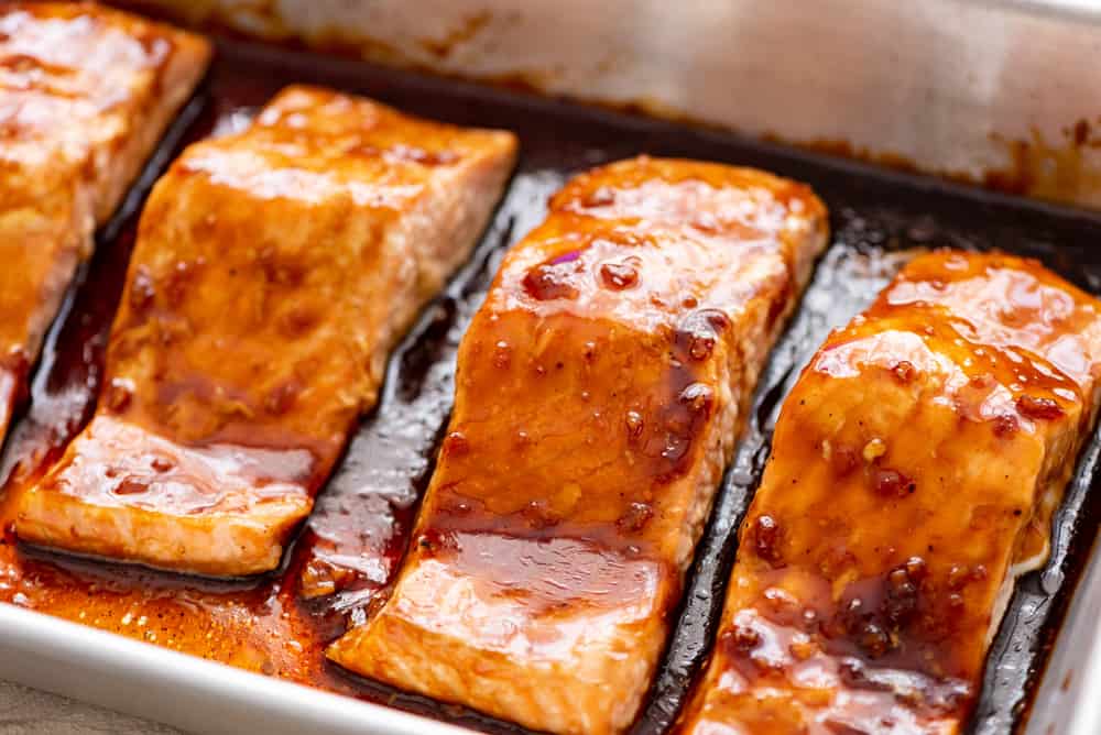 ย ย ย Baked Sesame Teriyaki Salmon is aย five star salmon bakedย with the best homemade sesame teriyaki sauce. This is easily one of the best thingsย that you will eat! getting ready to bake teriyaki salmon in the oven