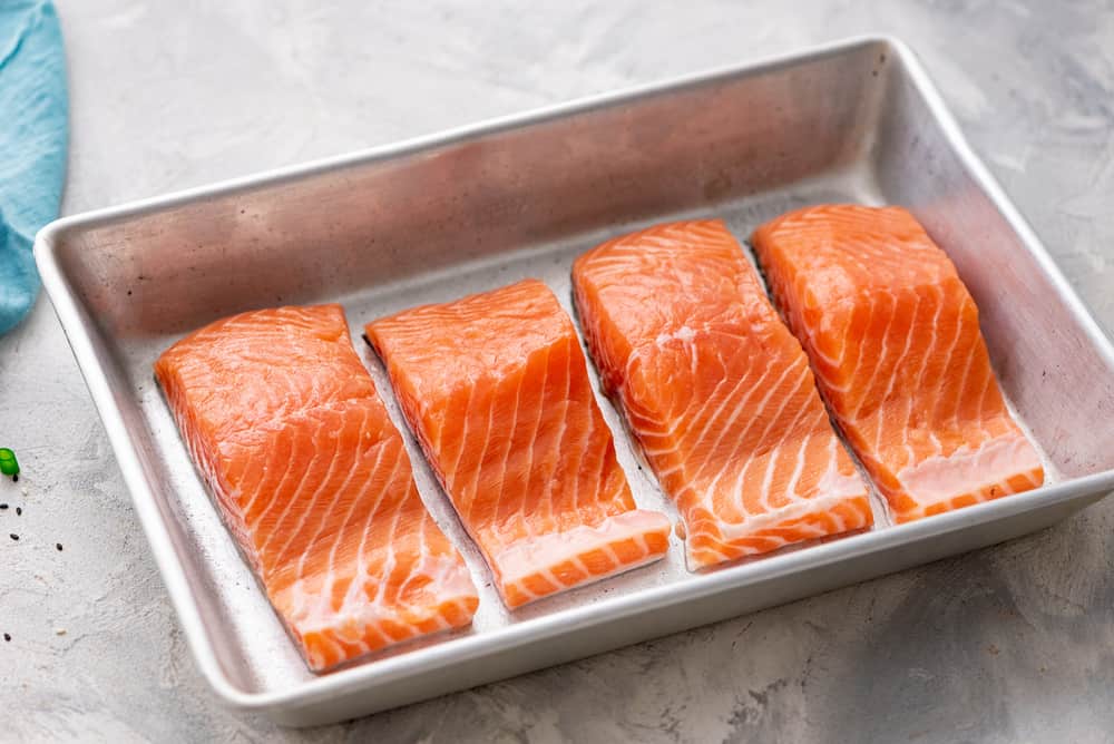 Baked Sesame Teriyaki Salmon is aย five star salmon bakedย with the best homemade sesame teriyaki sauce. This is easily one of the best thingsย that you will eat! salmon in a pan