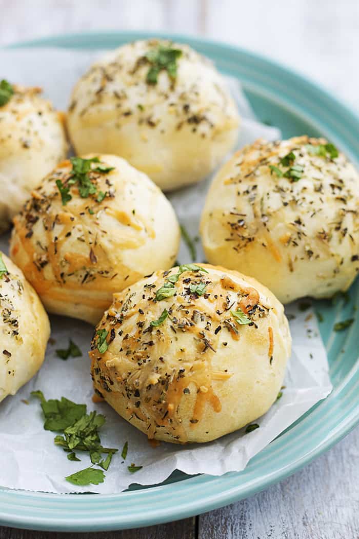 These cheesy pepperoni bombs are perfect for a snack or appetizer… or if you’re like me, for dinner! pepperoni bombs on a blue plate