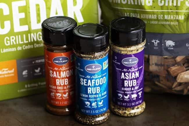 A five starย salmon recipe that gets infused with a lemon, lime and orange marinade. It grills to tender and flaky perfection and has the best sweet and tangy flavor! fire and flavor rub shakers.