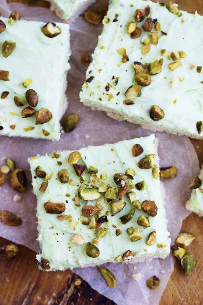 A creamy and a delicious pistachio dessert on top of a buttery shortbread crust. This dessert is quick and easy and perfect for your next potluck! pistachio cream bars areal view.