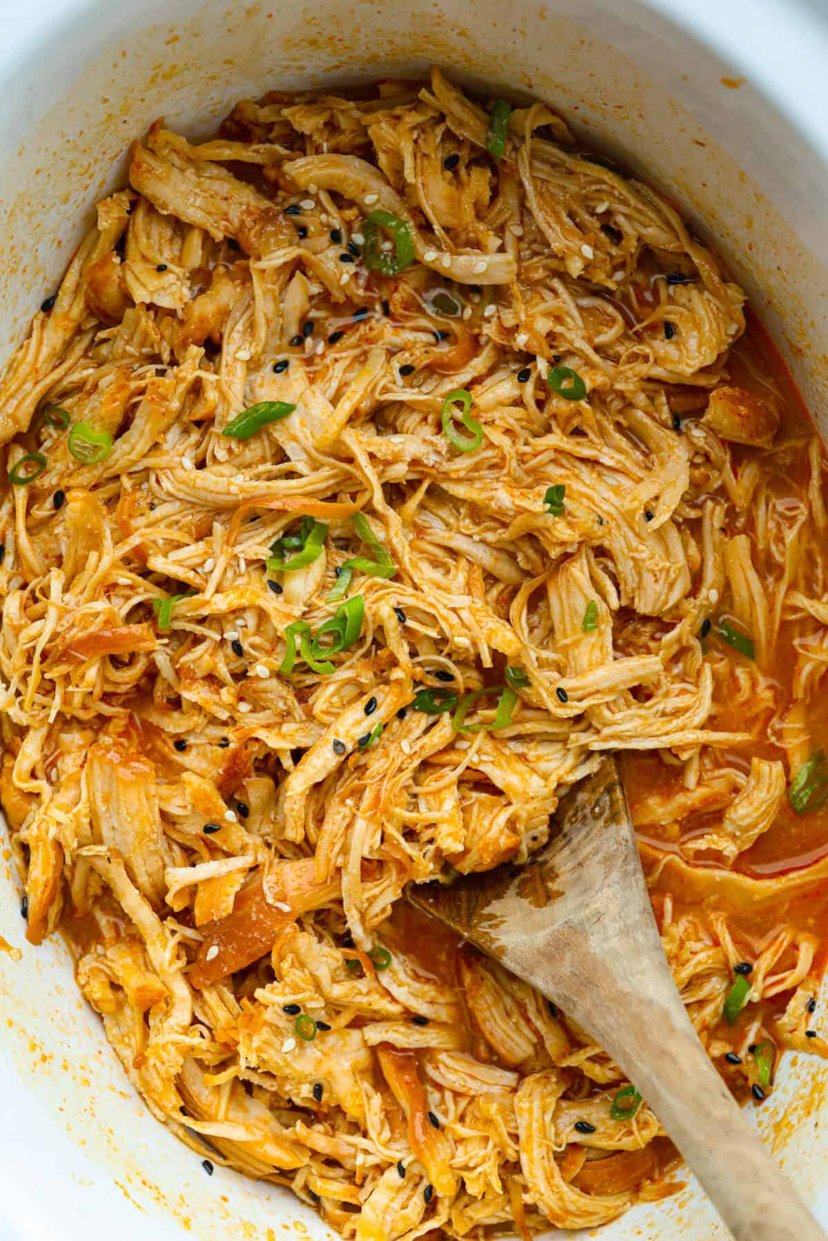 My spicy Slow Cooker Honey Sriracha Chicken is moist, tender, and out-of-this-world delicious with the sweet and spicy sauce! If you love sriracha, you'll love this! Slow cooker honey sriracha chicken in a crockpot.