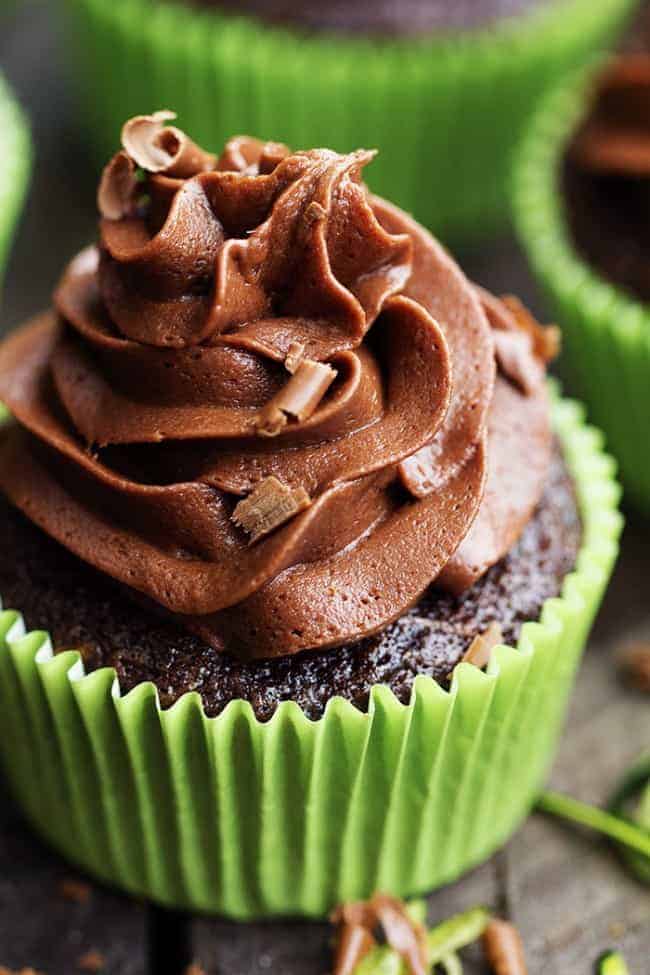 Chocolate Zucchini Cupcakes with Chocolate Cream Cheese Frosting are moist and perfect chocolate cupcakes with two cups of zucchini hidden inside! Topped with chocolate cream cheese frosting these are the best chocolate cupcakes I have had! Close up on Chocolate Zucchini Cupcakes