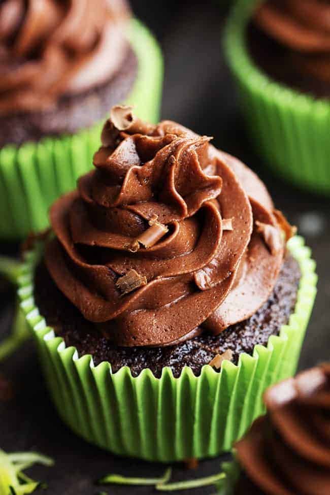 Chocolate Zucchini Cupcakes with Chocolate Cream Cheese Frosting are moist and perfect chocolate cupcakes with two cups of zucchini hidden inside! Topped with chocolate cream cheese frosting these are the best chocolate cupcakes I have had! Close up on Chocolate Zucchini Cupcakes