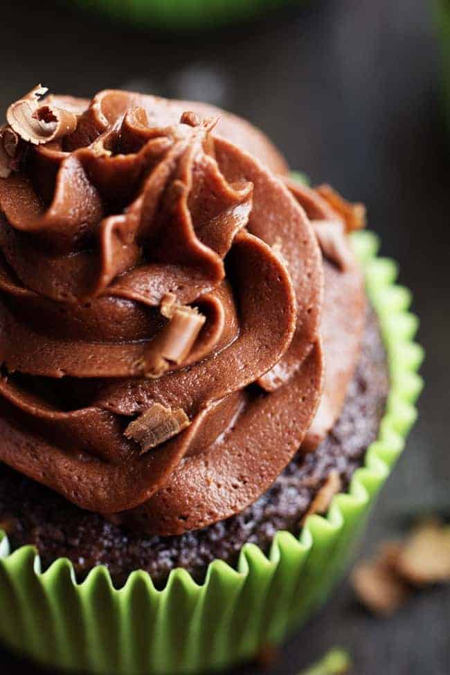 Chocolate Zucchini Cupcakes with Chocolate Cream Cheese Frosting are moist and perfect chocolate cupcakes with two cups of zucchini hidden inside! Topped with chocolate cream cheese frosting these are the best chocolate cupcakes I have had! Close up on chocolate icing.