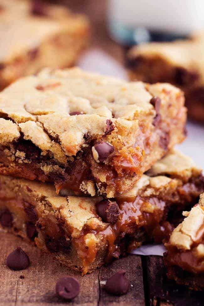 Stack of peanut butter caramel chocolate chip cookie bars.