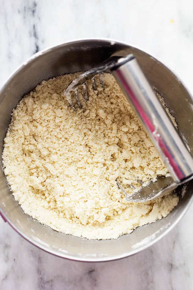 Tender, buttery, and easy-to-make, my Grandma's perfect pie crust is everything you need this Thanksgiving. It's so foolproof, you won't want storebought again! Using a pastry blender to cut ingredients.