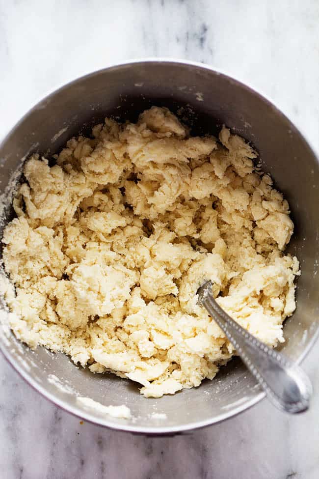 Tender, buttery, and easy-to-make, my Grandma's perfect pie crust is everything you need this Thanksgiving. It's so foolproof, you won't want storebought again! Adding water to dough.
