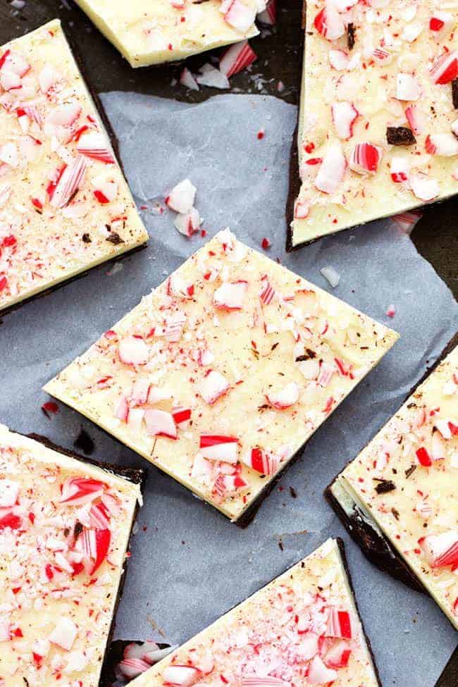 Layered semi-sweet and white chocolate flavored with mint and topped with crushed candy canes. This is so easy to make and a holiday classic! peppermint bark cut into squares.