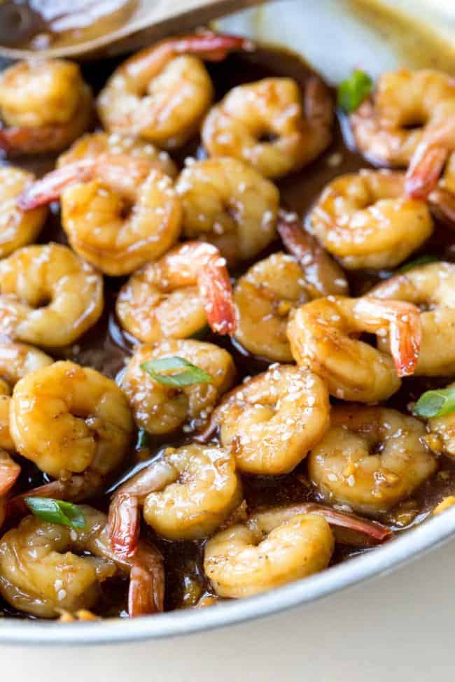 Super Easy Teriyaki Shrimp. Tender shrimp sautéed in a homemade teriyaki sauce. Takes less than 15 minutes to make! Up close photo of teriyaki shrimp.