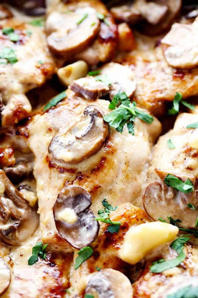 Tender and juicy chicken in the most amazing creamy and delicious garlic mushroom sauce! This makes one incredible 30 minute meal! Up close photo of creamy garlic mushroom chicken.