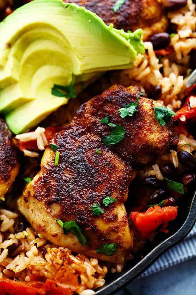 An amazing one pan meal with tender and juicy cajun blackened chicken over delicious southwest rice! This meal became an instant favorite at our house! One Pan Southwest Blackened Cajun Chicken with Rice with fresh avocado on the side.