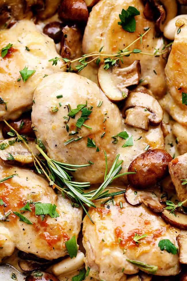 Creamy Garlic Herb Mushroom Chicken is a quick and easy 30 minute meal with amazing restaurant quality taste! The creamy garlic and fresh herb mushroom sauce over this chicken is insanely delicious! Close up photo of Creamy Garlic Herb Mushroom Chicken.