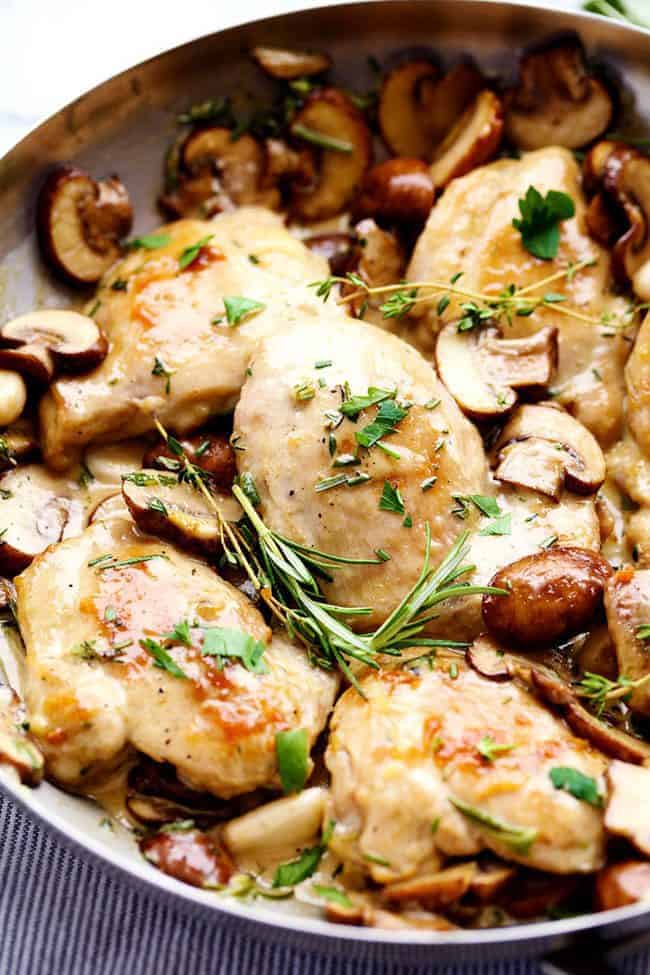 Creamy Garlic Herb Mushroom Chicken is a quick and easy 30 minute meal with amazing restaurant quality taste! The creamy garlic and fresh herb mushroom sauce over this chicken is insanely delicious! Creamy Garlic Herb Mushroom Chicken in a frying pan.