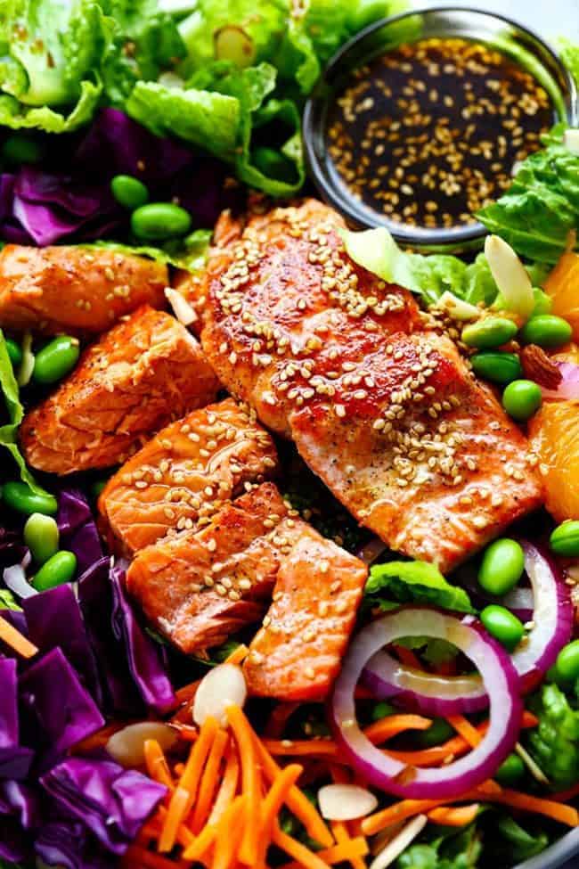 Asian Pan Seared Salmon Salad is bright and vibrant and complete with an amazing honey sesame dressing that takes this salad to a whole new level of delicious! Asian Pan Seared Salmon Salad.