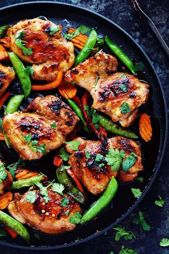 Thai Barbecue Chicken has a delicious thai marinade and is perfect served with some grilled veggies! The entire family will love this recipe! Thai Barbecue Chicken in a serving dish.