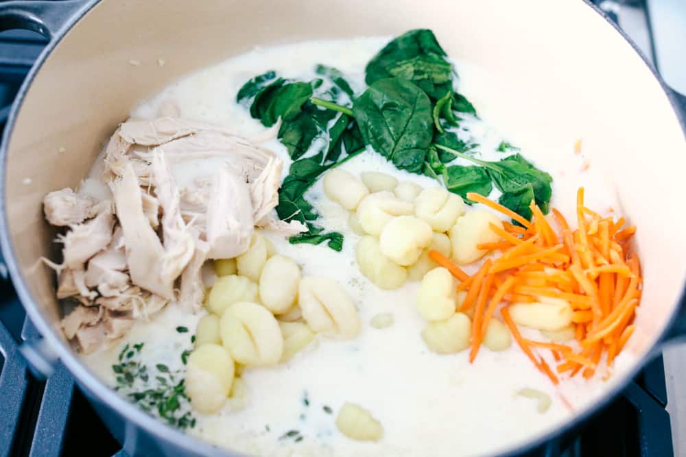 Creamy Chicken Gnocchi Soupย has a thick and rich broth with shredded carrots, celery, chopped spinach, gnocchi and chicken hidden throughout. This tastes even better than the Olive Garden! The ingredients in chicken gnocchi soup.