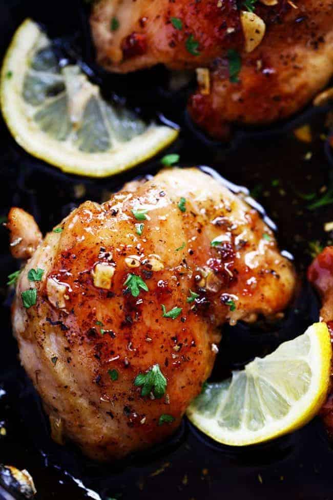 Glazed Lemon Honey Garlic Chicken is tender and juicy chicken cooked in the skillet toppedย the most amazing lemon honey garlic glaze! ย You are going to love this simple but full of flavor 30 minute meal!ย glazed lemon garlic honey chicken