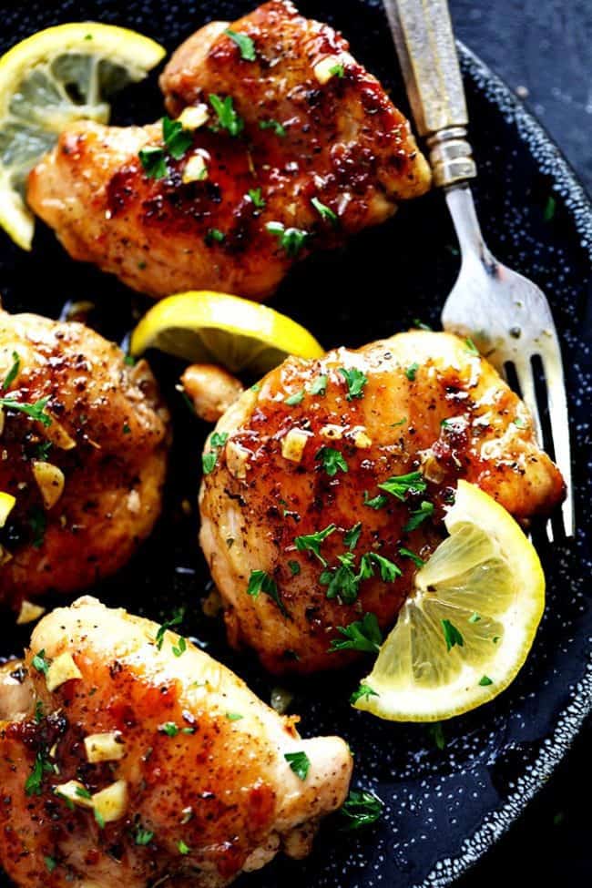 Glazed Lemon Honey Garlic Chicken is tender and juicy chicken cooked in the skillet toppedย the most amazing lemon honey garlic glaze! ย You are going to love this simple but full of flavor 30 minute meal!ย lemon garlic chicken